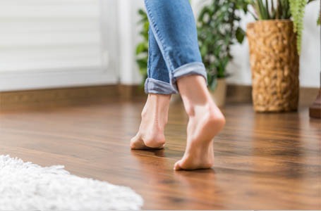 barefoot walking on hardwood floor